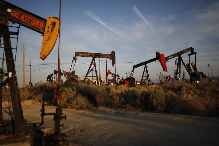 Pump jacks and wells are seen in an oil field on the Monterey Shale formation on March 23, 2014
