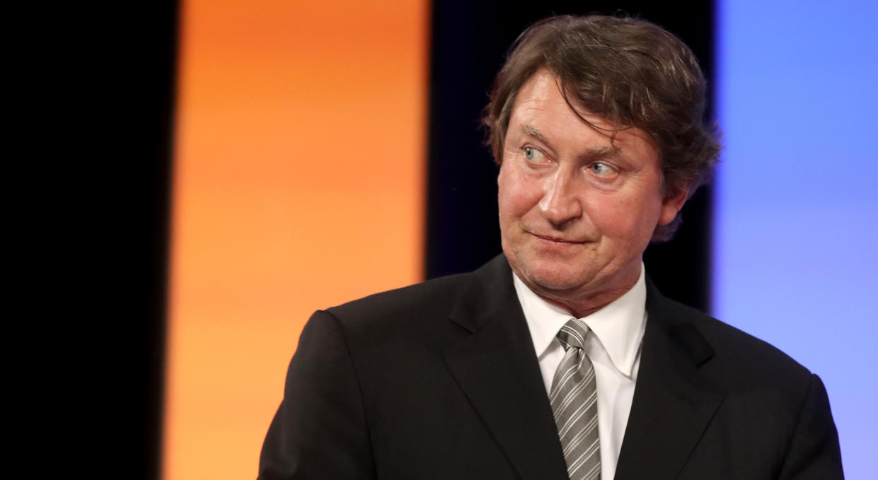 Wayne Gretzky will not make his return behind the bench at this winter's Spengler Cup. (Photo by Bruce Bennett/Getty Images)