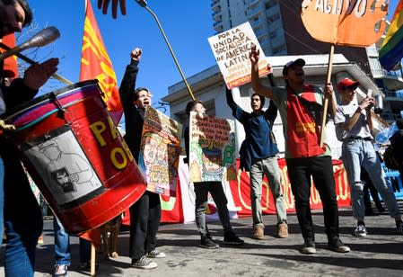 Demonstrators protest outside the 54th Summit of Heads of State of Mercosur and Associated States, in Santa Fe