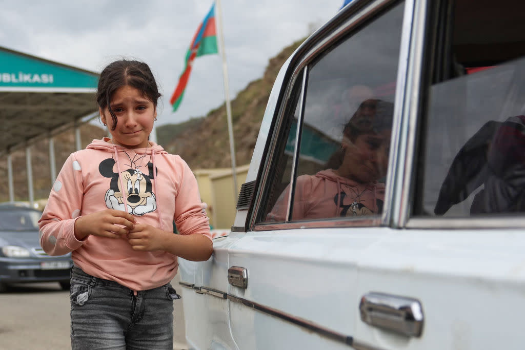  A refugee child cries at the border of Nagorno-Karabakh. 