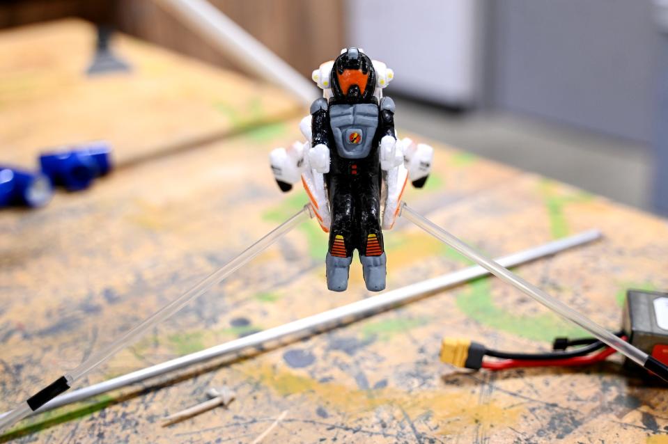 A tiny passenger used in rockets sits on a work table in Bob Richards' robotics class on Tuesday, Feb. 7, 2023, at Stockbridge High School.