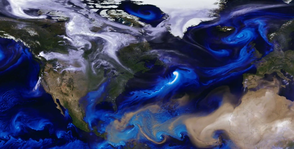 White smoke, blue sea salt and tan dust swirl across the globe like sand in a sculpture in this NASA simulation of the Earth's atmosphere. <cite>NASA's Goddard Space Flight Center</cite>