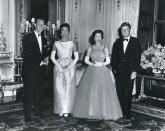 <p>At Buckingham Palace during a banquet held in his honor, American President John F. Kennedy and First Lady Jacqueline Kennedy pose with Queen Elizabeth II of Great Britain (second right) and her husband, Prince Philip, Duke of Edinburgh (left). Mrs. Kennedy's dress was designed by Chez Ninon while the Queen wore a Hartnell gown.</p>