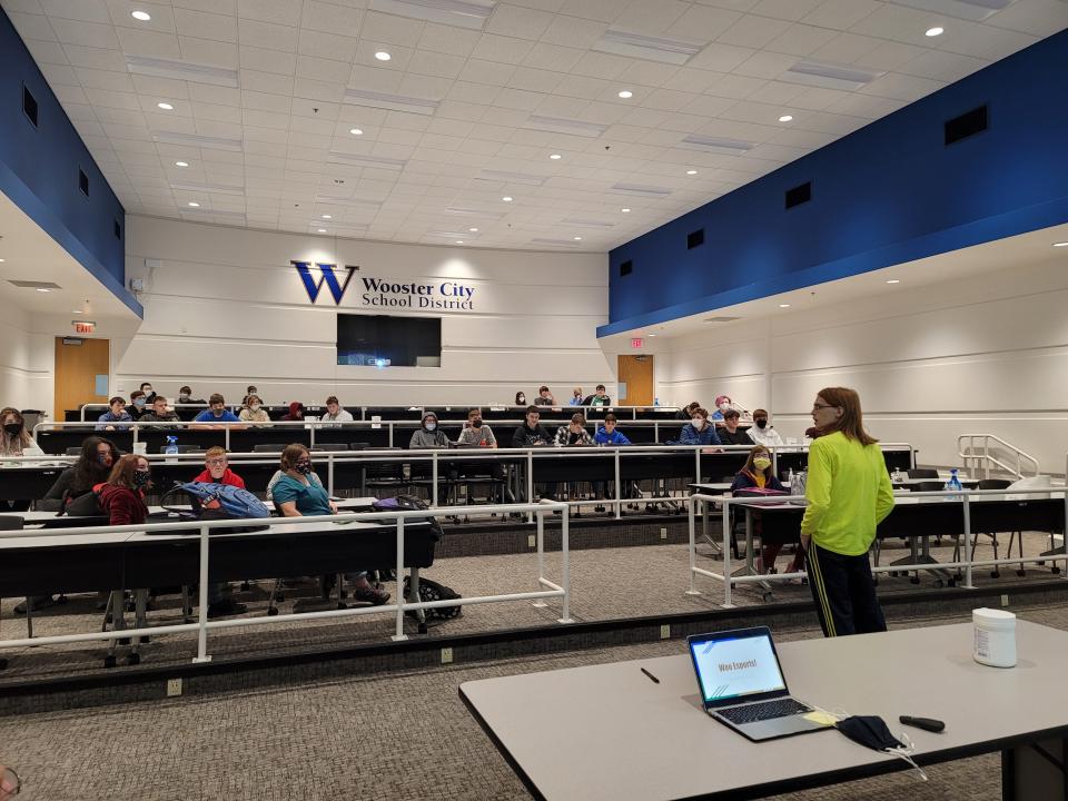 Senior Logan Brown (far right) tells a group of roughly 50 fellow students Nov. 16 at Wooster High School about a new esports team they have created.