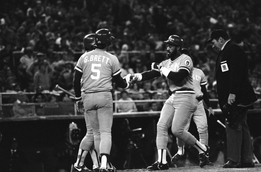 Willie Mays Aikens, Royals first baseman, is congratulated by teammate George Brett after stroking a second home run against the Phillies in first World Series game at Veterans stadium in Philadelphia on Tuesday, Oct. 14, 1980. Despite his effort, the Royals went down to defeat, 7-6. (AP Photo)