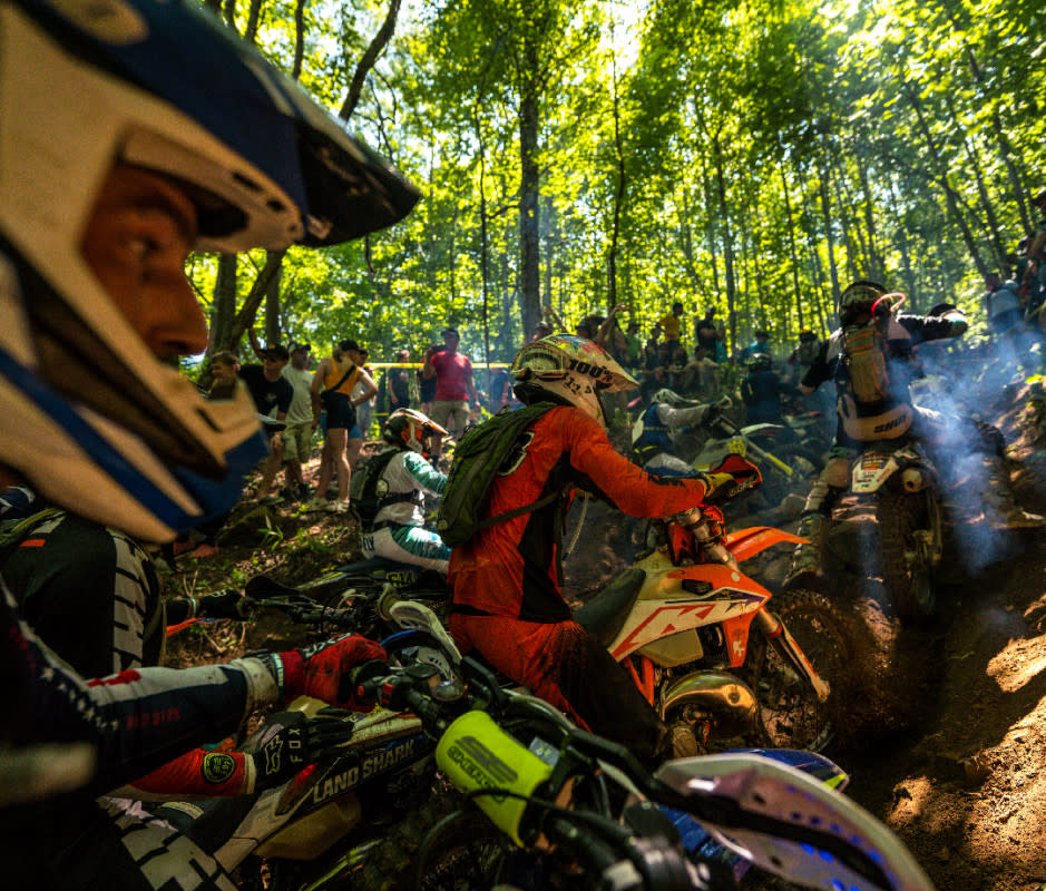 Race fans file into the woods in giant waves, jockeying for position around the steepest hills, rockiest creek beds, and muddiest ruts for a chance to see dirt bikes do the impossible.<p>Courtesy Image</p>