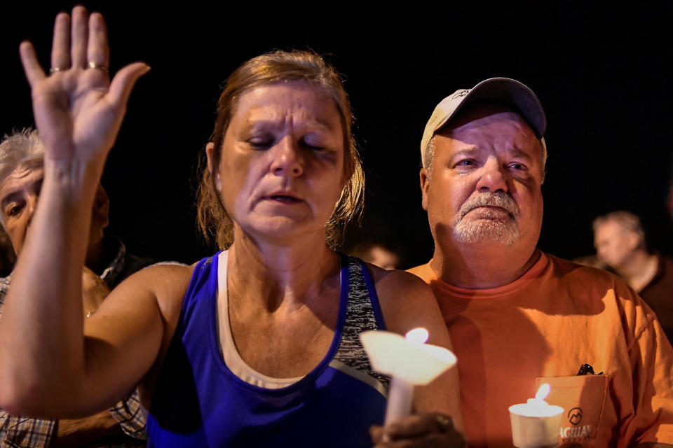 Local residents take part in a vigil for victims of a mass shooting in Sutherland Springs, Texas.