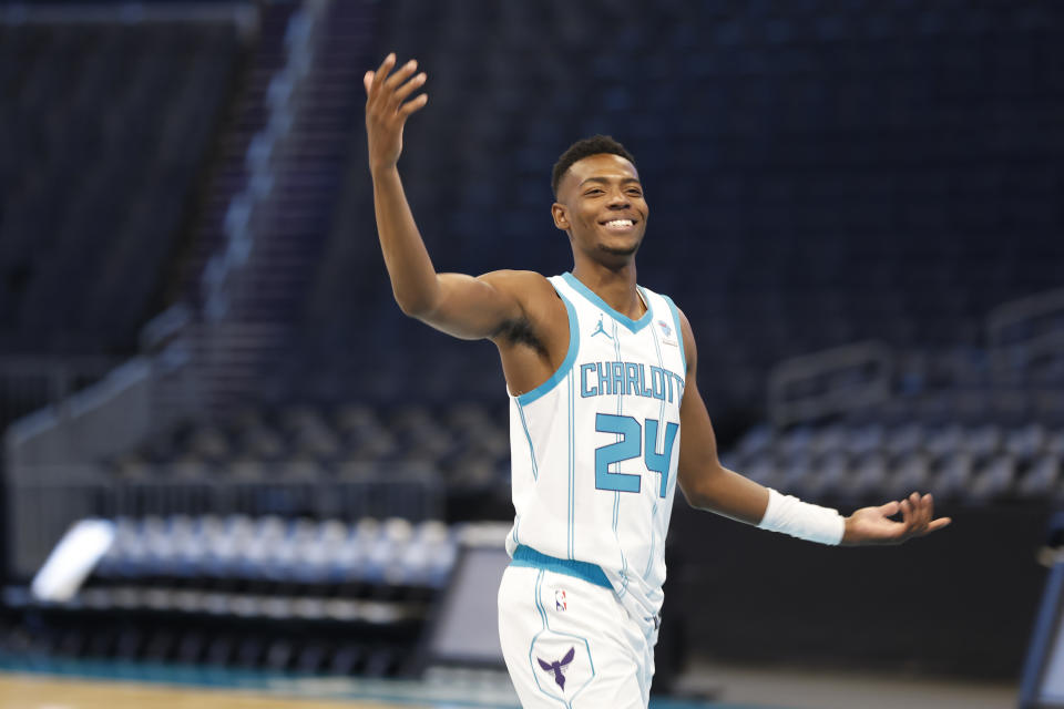 Charlotte Hornets forward Brandon Miller reacts to teammates at the NBA basketball's team media day in Charlotte, N.C., Monday, Oct. 2, 2023. (AP Photo/Nell Redmond)
