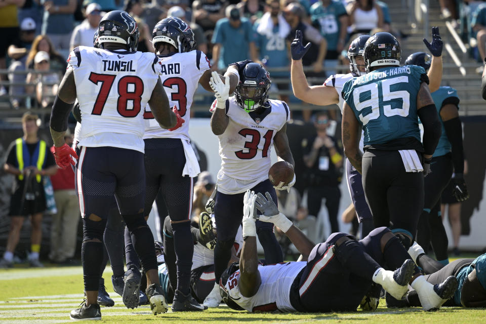 Houston Texans running back Dameon Pierce (31) celebrate his one-yard touchdown against the Jacksonville Jaguars during the second half of an NFL football game in Jacksonville, Fla., Sunday, Oct. 9, 2022. (AP Photo/Phelan M. Ebenhack)