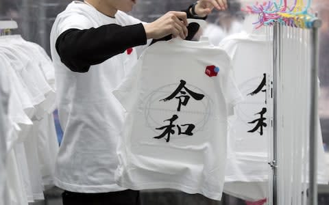 T-shirts have been manufactured marking the new era - Credit: Tomohiro Ohsumi/Getty Images