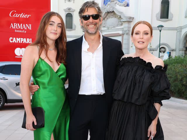 <p>Pascal Le Segretain/Getty</p> Liv Freundlich, Bart Freundlich and Julianne Moore arrive for the Closing Ceremony red carpet during the 79th Venice Film Festival on September 10, 2022.