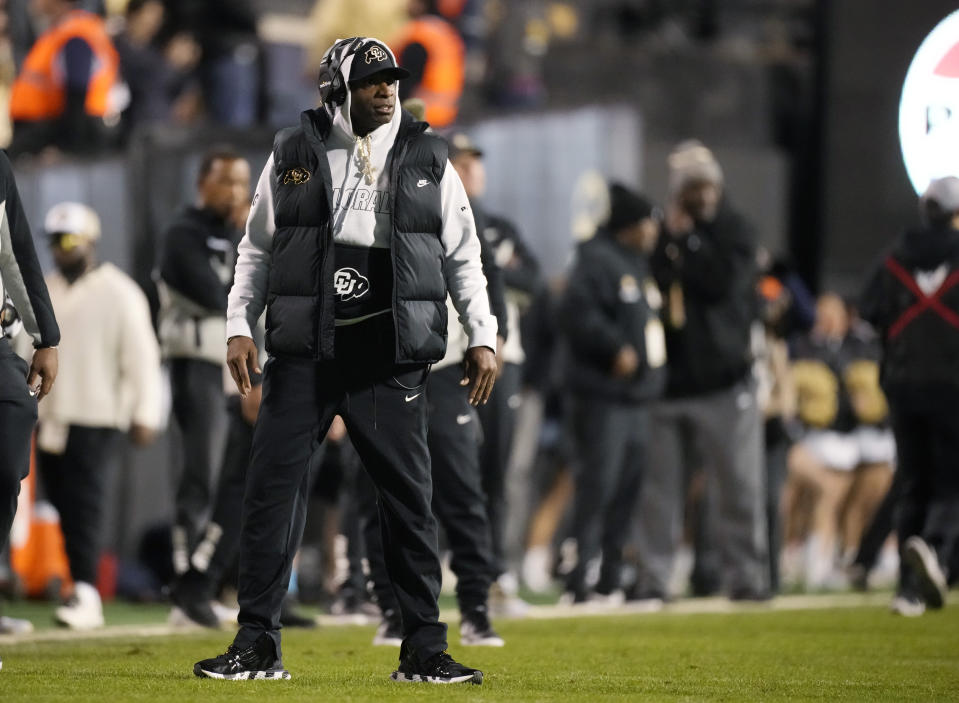 Colorado coach Deion Sanders stands on the field during the second half of the team's NCAA college football game against Oregon State on Saturday, Nov. 4, 2023, in Boulder, Colo. (AP Photo/David Zalubowski)