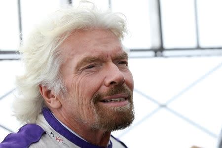 Richard Branson poses at the Empire State Building to promote the DS Virgin Racing team and The New York City ePrix in New York City, U.S., July 14, 2017. REUTERS/Brendan McDermid/Files