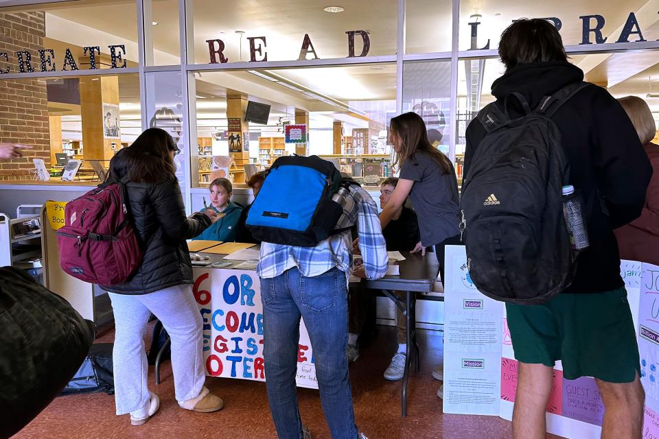 Brattleboro Union High School students register to vote during a voter drive at the school, Feb. 14, 2024, in Brattleboro, Vt. Sixteen and 17-year-olds in Brattleboro will get to vote in local elections and if they're 18 by the November general election, they can cast ballots in the Super Tuesday presidential primary.