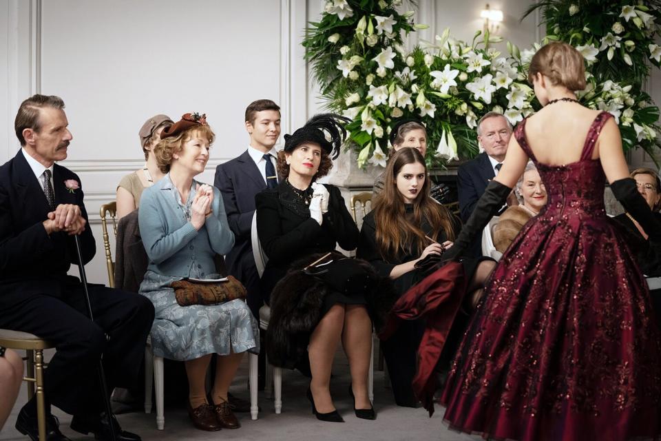 MRS HARRIS GOES TO PARIS sitting, from left: Lambert Wilson, Lesley Manville, Guilaine Londez, Dorottya Ilosvai, standing: Alba Baptista