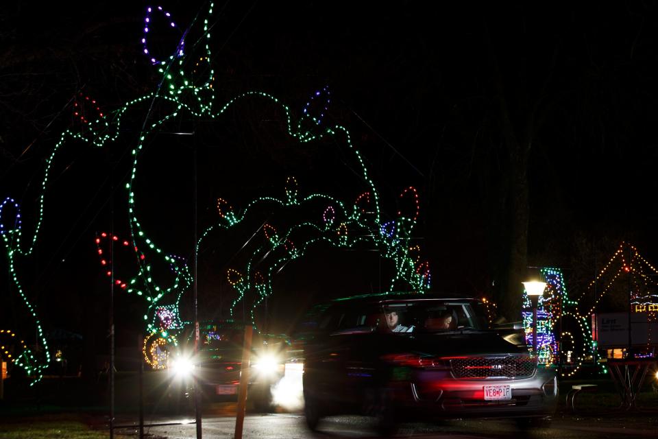 People drive through Jolly Holiday Lights at Adventureland Park on Friday, Nov. 27, 2020, in Altoona. The lights have moved to Outlets of Des Moines this year.