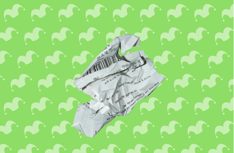 A crumpled receipt on top of a green background