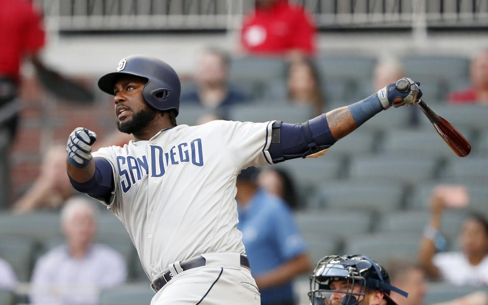 San Diego Padres' Franmil Reyes (32) follows through on a solo home run in the first inning of a baseball game against the Atlanta Braves Tuesday, April 30, 2019, in Atlanta. (AP Photo/John Bazemore)