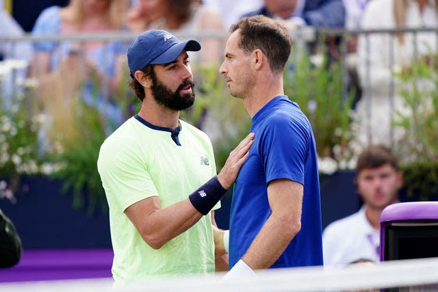 Jordan Thompson consoles Andy Murray after the British player retired from their match