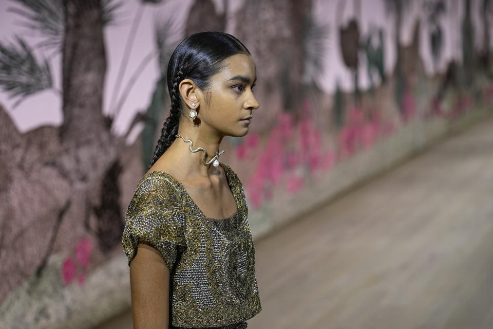 A model wears a creation for the Christian Dior Haute Couture Fall/Winter 2023-2024 fashion collection presented in Paris, Monday, July 3, 2023. (AP Photo/Michel Euler)