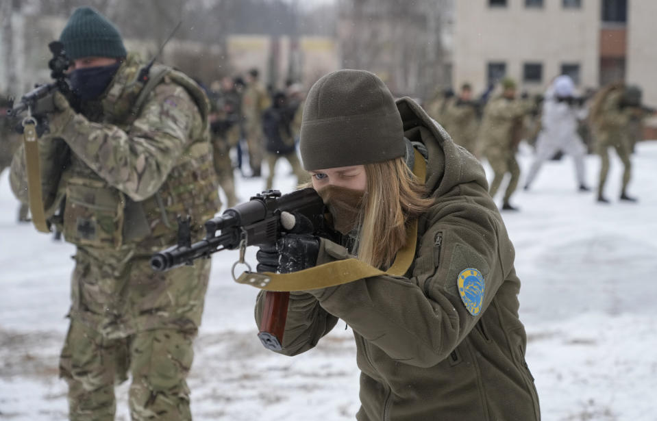 Members of Ukraine's Territorial Defense Forces, volunteer military units of the Armed Forces, train close to Kyiv, Ukraine, Saturday, Feb. 5, 2022. Hundreds of civilians have been joining Ukraine's army reserves in recent weeks amid fears about a Russian invasion. (AP Photo/Efrem Lukatsky)