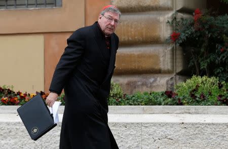 FILE PHOTO - Australian Cardinal George Pell arrives for a meeting at the Synod Hall in the Vatican March 6, 2013. REUTERS/Tony Gentile/File Photo