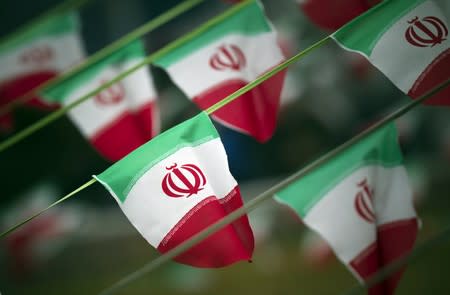 Iran's national flags are seen on a square in Tehran