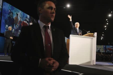 Agents guard Israel's Prime Minister Benjamin Netanyahu (R) as he takes the stage to address the American Israel Public Affairs Committee (AIPAC) policy conference in Washington, March 2, 2015. REUTERS/Jonathan Ernst