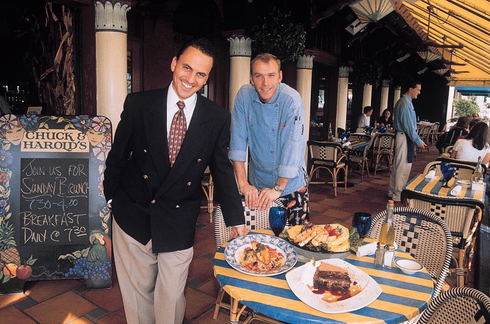 Chuck & Harold's general manager, Drew Minervino, left, and executive chef, Kevin Sawyer, show samples of their dishes at the restaurant in 2000.