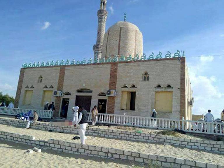 Egypt mosque attack: Bomb and gun assault in North Sinai kills at least 235 people - as it happened