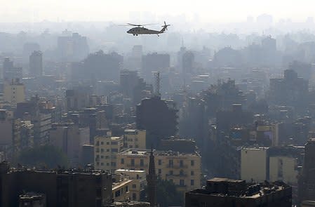 A military helicopter conducts an aerial patrol over Cairo, as part of heightened security measures ahead of the anniversary of the 25th of January uprising, in Egypt, January 17, 2016. REUTERS/Asmaa Waguih