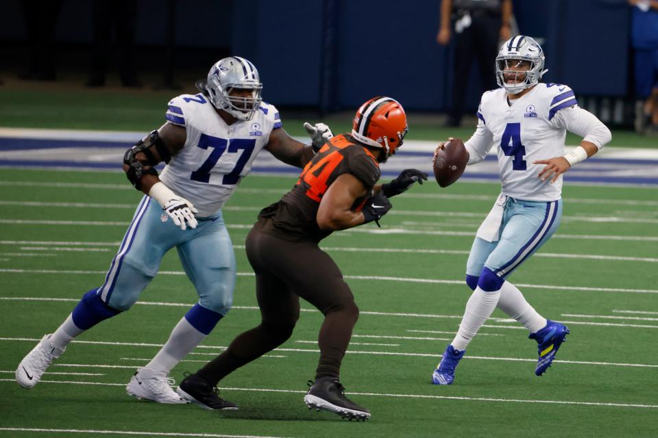 Dallas Cowboys offensive tackle Tyron Smith (77) defends against pressure from Cleveland Browns defensive end Olivier Vernon (54) as quarterback Dak Prescott (4) looks to make a pass.