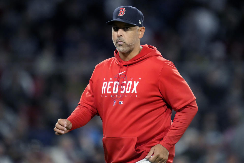 Boston Red Sox's manager Alex Cora heads back to the dugout after a visit to the pitcher's mound during the sixth inning of a baseball game against the Tampa Bay Rays at Fenway Park, Wednesday, Sept. 27, 2023, in Boston. (AP Photo/Charles Krupa)