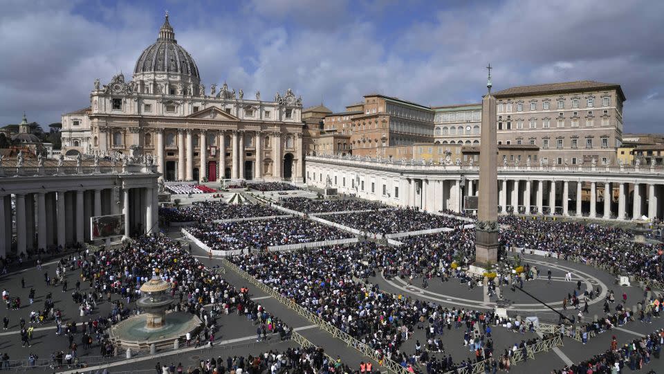 Crowds gather in St. Peter's Square during the Palm Sunday mass. - Gregorio Borgia/AP