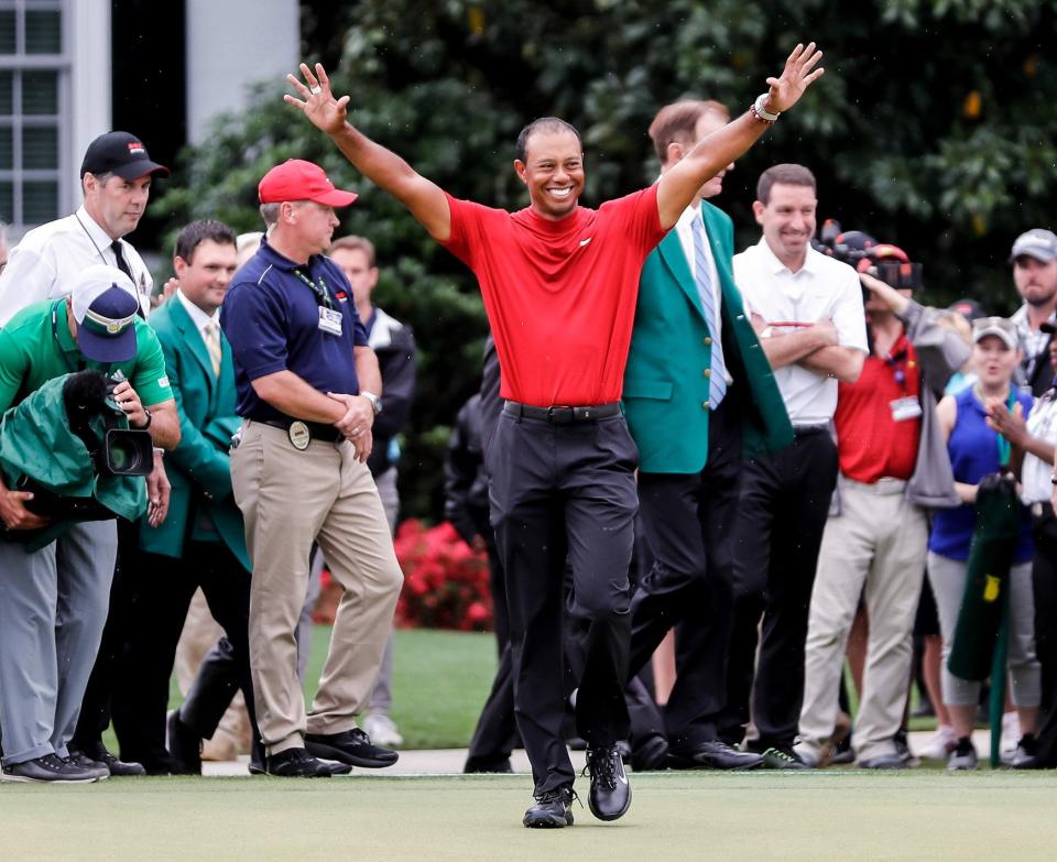 Tiger Woods celebrates before donning the green jacket after winning the 2019 Masters at Augusta National.