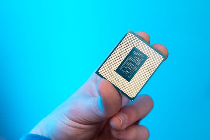 Someone holding the Core i9-12900KS processor.