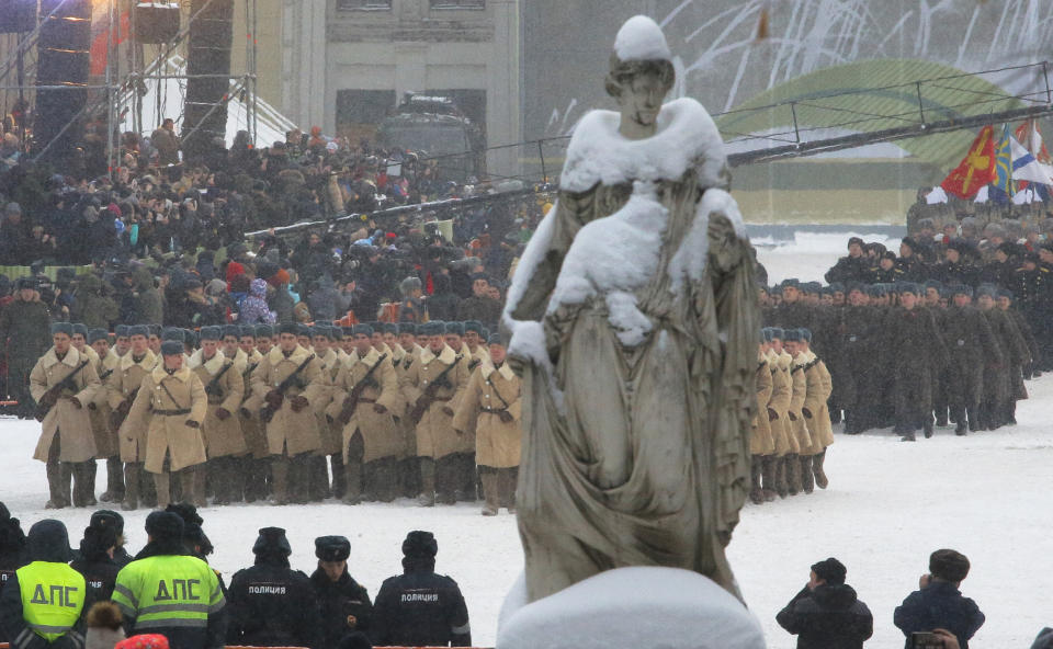 Russian army soldiers wearing Soviet army World War II uniform march in snowfall during a military parade at Dvortsovaya (Palace) Square during the celebration of the 75th anniversary of the end of the Siege of Leningrad during World War II in St. Petersburg, Russia, Sunday, Jan. 27, 2019. The Nazi German and Finnish siege and blockade of Leningrad, now known as St. Petersburg, was broken on Jan. 18, 1943 but finally lifted Jan. 27, 1944. More than 1 million people died mainly from starvation during the 900-day siege. (AP Photo/Dmitri Lovetsky)