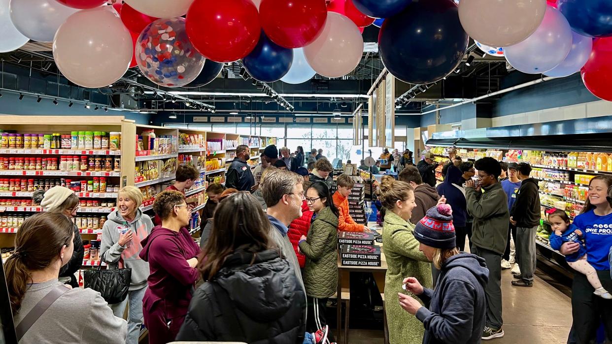 People participate in a grand opening celebration for the new Bank of America Community Resource Room at The Market at Eastpoint & Eastside Eatery, 1708 NE 23.