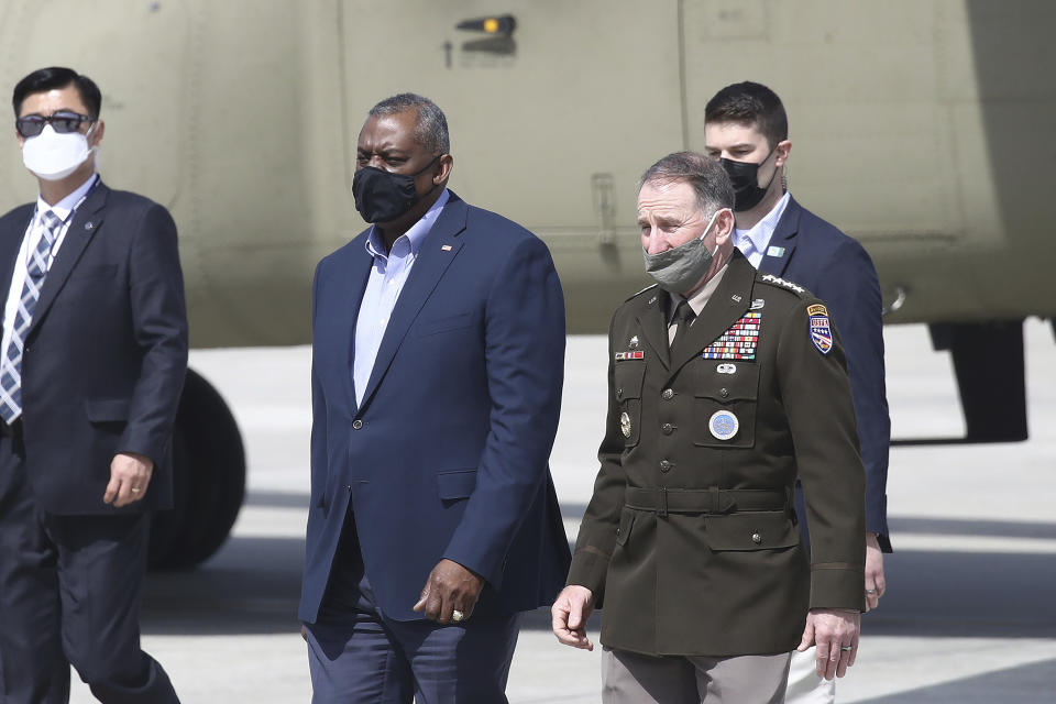 U.S. Secretary of Defense Lloyd Austin, center left, walks with United States Forces Korea, Gen. Robert B. Abrams, after Austin arrived at Osan Air Base in Pyeongtaek, South Korea Wednesday, March 17, 2021. Austin, with U.S. Secretary of State Antony Blinken, on Wednesday, is visiting South Korea, with the focus of those talks being North Korea and its nuclear ambitions.(Chung Sung-Jun/Pool Photo via AP)