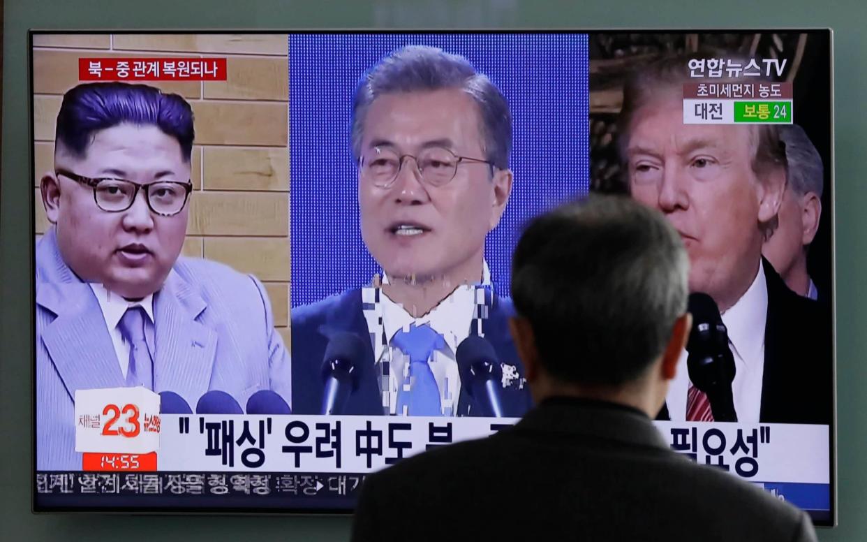 Donald Trump, Moon Jae-in of South Korea and Kim Jong Un of North Korea displayed on a TV screen in Seoul, during a period of intense diplomatic activity - AP