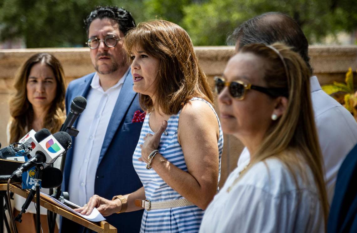 Florida State Senator Annette Taddeo, center, speaks to reporters during the press conference held in front of Freedom Tower in downtown Miami on Aug. 22, 2022.