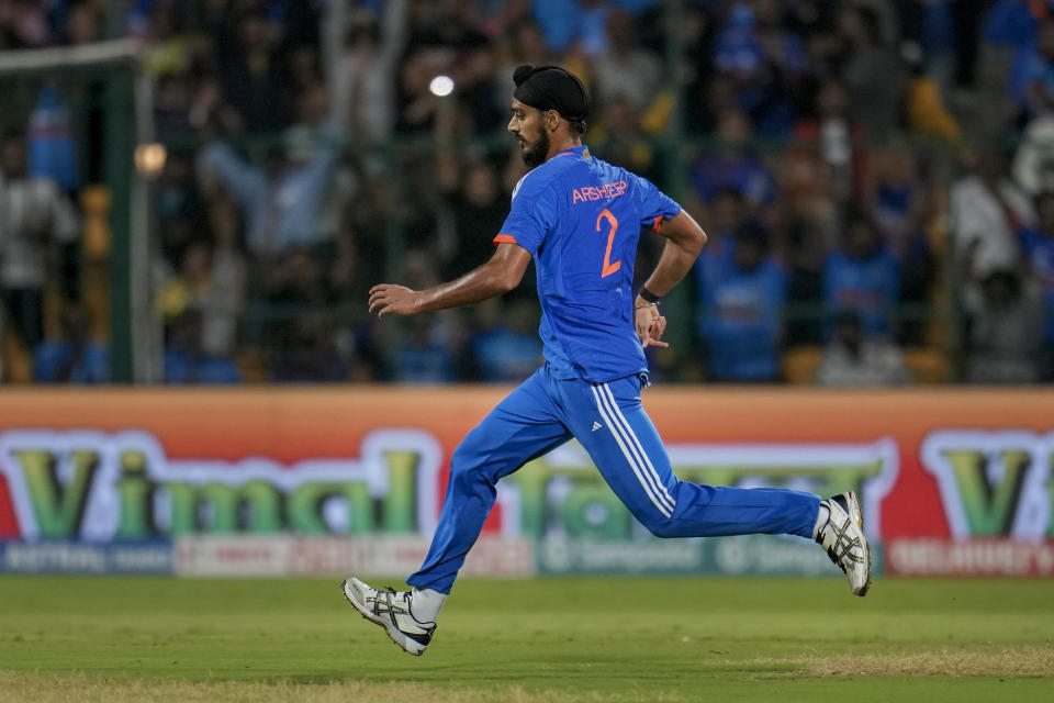 India's Arshdeep Singh runs to field the ball during the fifth T20 cricket match between India and Australia in Bengaluru, India, Sunday, Dec. 3, 2023. (AP Photo/Aijaz Rahi)
