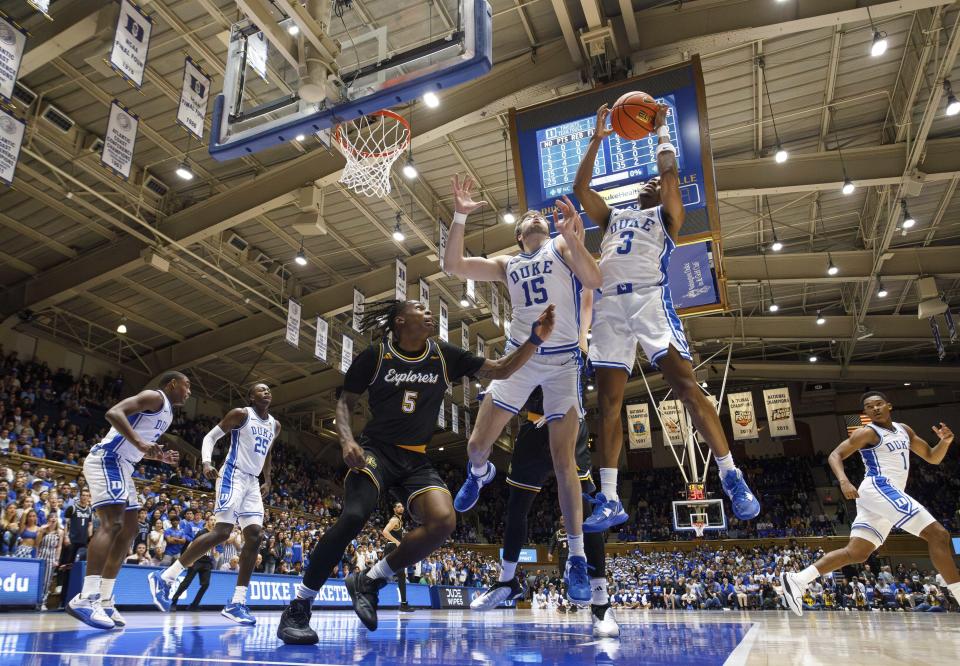 Duke's Jeremy Roach (3) grabs a rebound next to Ryan Young (15) and La Salle's Khalil Brantley (5) during the first half of an NCAA college basketball game in Durham, N.C., Tuesday, Nov. 21, 2023. (AP Photo/Ben McKeown)