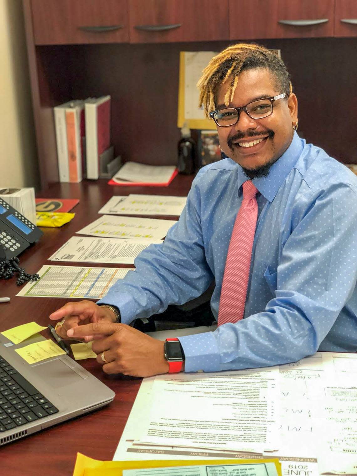 Qaadir Phillips submitted this recent photograph of himself at his desk at M.C. Riley Elementary School in Bluffton. Phillips, an employee of the Beaufort County School District, is a data specialist for the school.