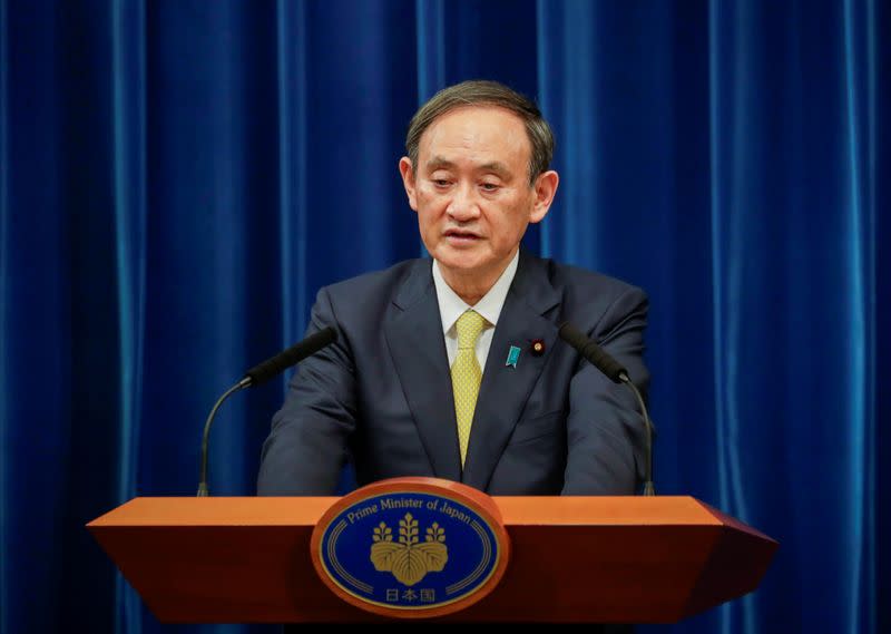 FILE PHOTO: Japanese Prime Minister Yoshihide Suga speaks during a news conference in Tokyo