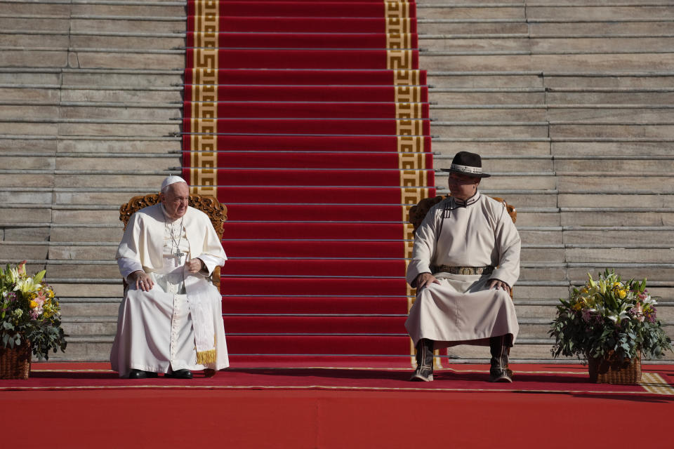 Mongolian President Ukhnaagin Khurelsukh, right, meets with Pope Francis, Saturday, Sept. 2, 2023, in Sukhbaatar Square in Ulaanbaatar. Pope Francis arrived in Mongolia on Friday morning for a four-day visit to encourage one of the world's smallest and newest Catholic communities. (AP Photo/Andrew Medichini)