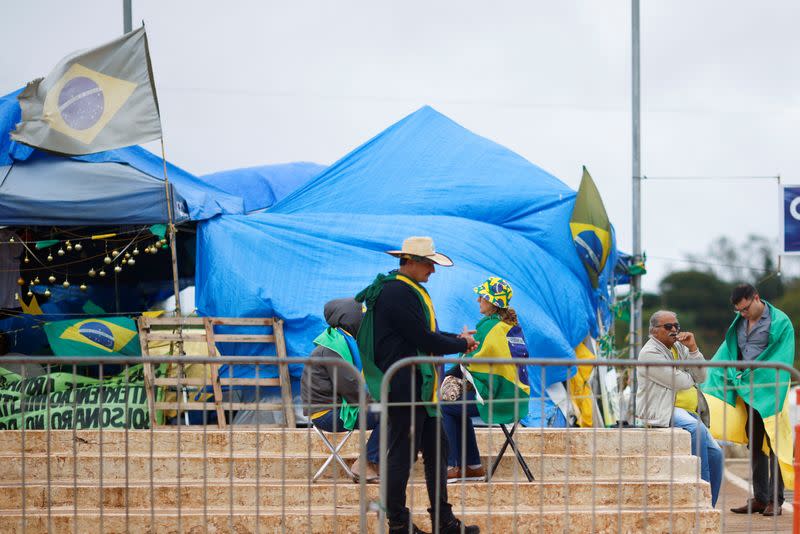 Supporters of of Brazil's President Jair Bolsonaro are seen at a camp during a protest against President-elect Luiz Inacio Lula da Silva at the Army Headquarters in Brasilia