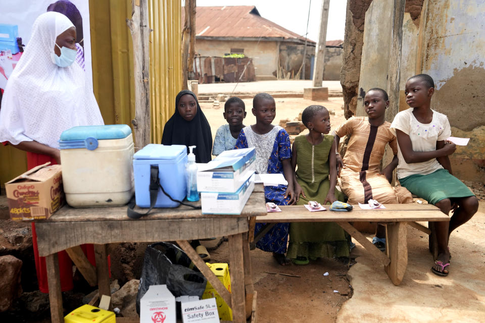 Young girls who have been vaccinated with HPV Gardasil vaccine sit on a bench on the street in Ibadan, Nigeria, on May 27, 2024. African countries have some of the world's highest rates of cervical cancer. Growing efforts to vaccinate more young girls for the human papillomavirus are challenged by the kind of vaccine hesitancy seen for some other diseases. Misinformation can include mistaken rumors that girls won't be able to have children in the future. Some religious communities must be told that the vaccine is "not ungodly." More than half of Africa's 54 nations – 28 – have introduced the vaccine in their immunization programs, but only five have reached the 90% coverage that the continent hopes to achieve by 2030. (AP Photo/Sunday Alamba)