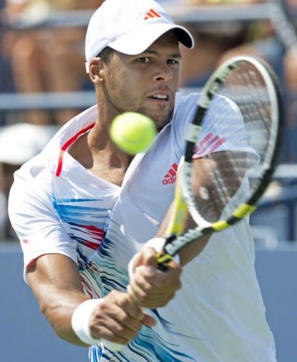 Jo-Wilfried Tsonga of France hits a return to Martin Klizan of Slovakia during thier men's match at the 2012 US Open tennis tournament August 30, 2012 in New York. Tsonga slumped to a shock 6-4, 1-6, 6-1, 6-3 second-round defeat to unheralded Klizan