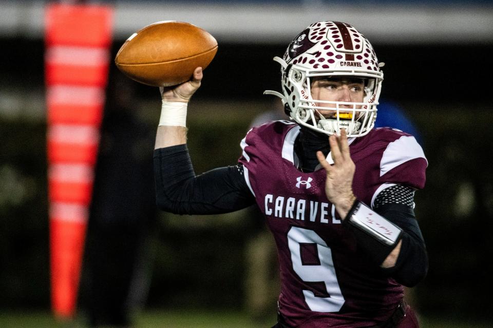 Caravel quarterback Truman Auwerda (9) winds up for a pass against Wilmington Friends during DIAA Class 2A football championship game at Delaware Stadium in Newark, Saturday, Dec. 10, 2022. Wilmington Friends won 10-7.